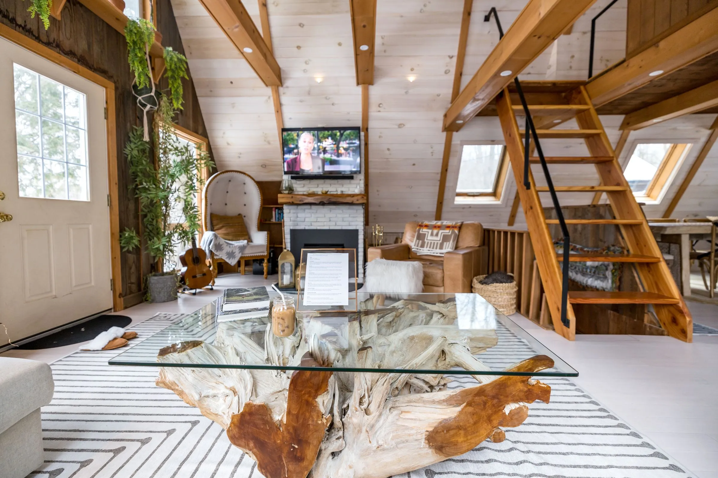 A living room under a steep timber roof