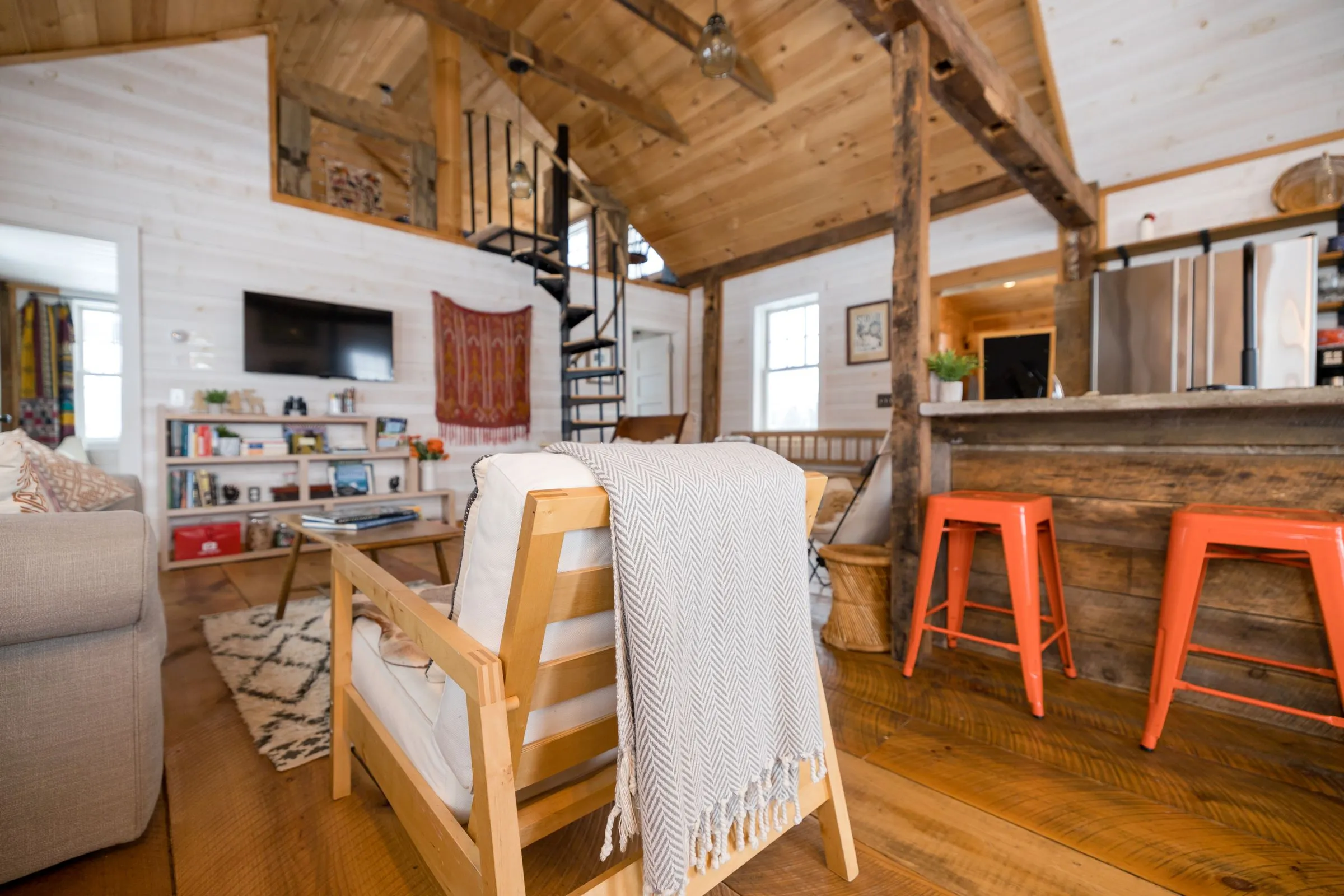 A bright cabin living room with a sofa